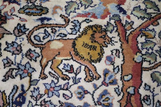 A Persian Tree of life ivory ground carpet W.275 x 180cm